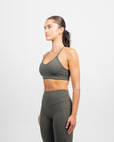 Side profile of sports bra showcasing sculpted fit and thin straps