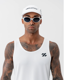 Man wearing the white Nexletica Perform Hat, front view, showing the NEXLETICA front print and curved brim