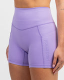 lose up of lilac Impulse High Waist Shorts waistband and pocket detail on model