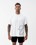 Man wearing the Nexletica Perform Hybrid Oversized T-Shirt in black, front view, showing the oversized outlined logo graphic and mock-crew neckline